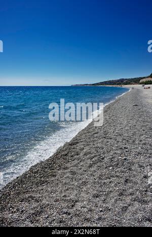 ITALY, Calabria, ionian sea coast, beach near Reggio Calabria, sicilian volcano Etna in the background Stock Photo