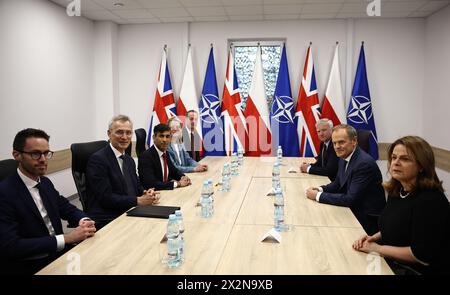NATO Secretary General Jens Stoltenberg (second from left), Prime Minister Rishi Sunak (third from left) and Polish Prime Minister Donald Tusk (second from right) prior to talks at the Warsaw Armoured Brigade in Warsaw during Rishi Sunak's visit to Poland and Germany. Picture date: Tuesday April 23, 2024. Stock Photo