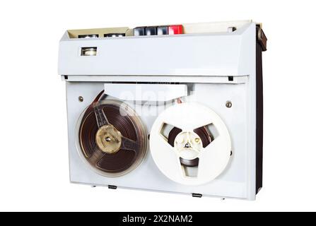 reel tape recorder on table, wall with newspaper, wallpapers Stock Photo