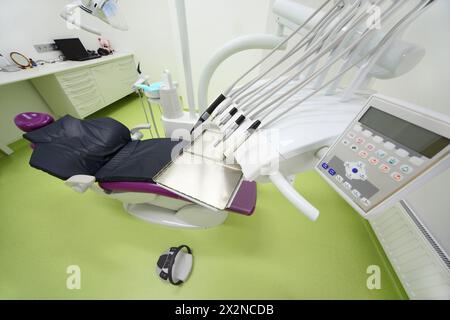 Empty dental clinic. Chair for patient and drill for dentist (tips for drills and control panel). Stock Photo