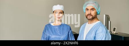 A man and woman in scrubs stand side by side. Stock Photo