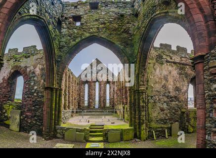 The image is of what was the interior of Peel Castle Abbey at the historic Peel Castle on the west coast of the Isle of Man. Stock Photo