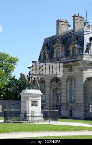 Statue of Henri d'Orléans, Duke of Aumale on a square outside of the Grandes Ecuries in Chantilly, Haut de France. Stock Photo