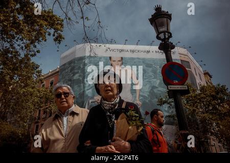 Barcelona, Spain. 21st Apr, 2024. An elderly couple walks along Barcelona's Rambla during Saint George's Day, also known as the 'Day of the book' in Catalonia. Credit: Matthias Oesterle/Alamy Live News Stock Photo