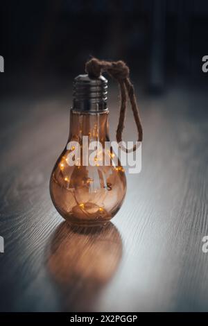 The dim light of a mysterious lamp against a gloomy background. Design and interior. High quality photo Stock Photo