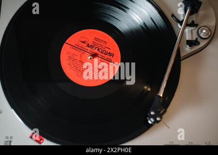 Retro photo of a vinyl record player. The photo was taken with a vintage retro Helios 44-7 lens, which gives the photo an authentic classic look. High Stock Photo