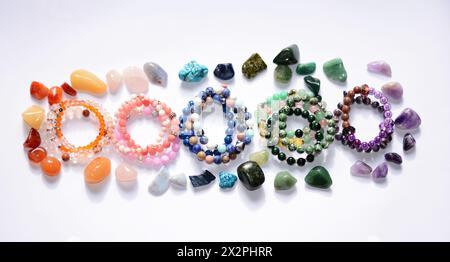The collection of beautiful raw mineral gemstones, complemented by handmade, one-of-a-kind bracelets, each gemstone is unique in its own pattern Stock Photo