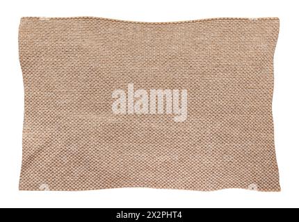 Square torn piece of brown fabric on a white background. Isolate light material for sewing clothes and upholstery of furniture Stock Photo