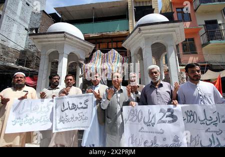 Members of Gandhara Hindko Board participate in rally to pay tribute to the score of people, who were killed 78 years ago by the firing of British Troops in Qissa Khawani Bazar Tragedy on 23rd April 1930, at Qissa Khawani Bazar in Peshawar on Tuesday, April 23, 2024. Stock Photo