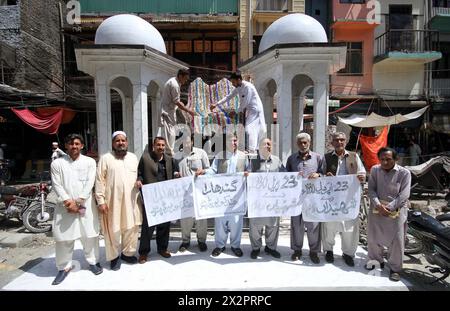 Members of Gandhara Hindko Board participate in rally to pay tribute to the score of people, who were killed 78 years ago by the firing of British Troops in Qissa Khawani Bazar Tragedy on 23rd April 1930, at Qissa Khawani Bazar in Peshawar on Tuesday, April 23, 2024. Stock Photo