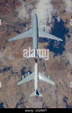 A RAAF KC-30A Multi-Role Tanker Transport from 33 Squadron, left, conducts air-to-air refuelling trials with a US Air Force Boeing RC-135. Photo: US A Stock Photo