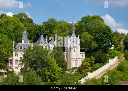 Pierrefonds, France - May 25 2020: The castle of Jonval built at the beginning of the XXth century on the ruins of an old medieval castle has a fairly Stock Photo