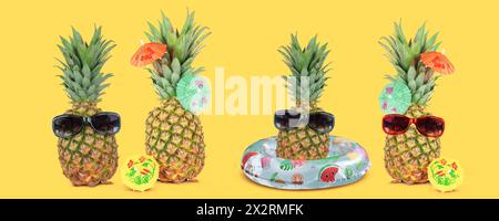 Tropical summer vacation concept with funny stylish pineapples isolated on yellow background. Stock Photo