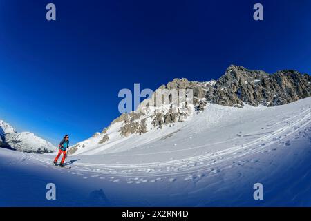 Mature woman back country skiing on Gruenstein, Mieming Range, Tyrol, Austria Stock Photo