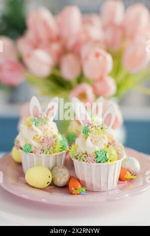Decorated Easter cupcakes in plate Stock Photo