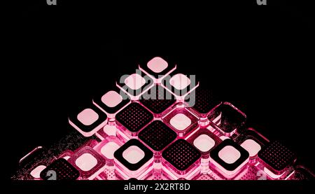 Black computer chips illuminated with pink light Stock Photo