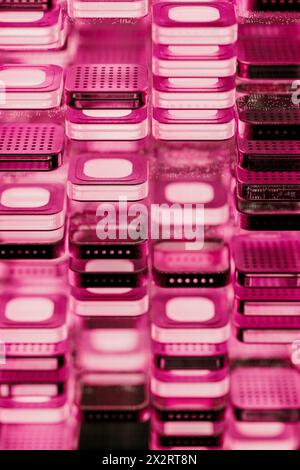 Layers of microchip blocks with illuminated pink light Stock Photo