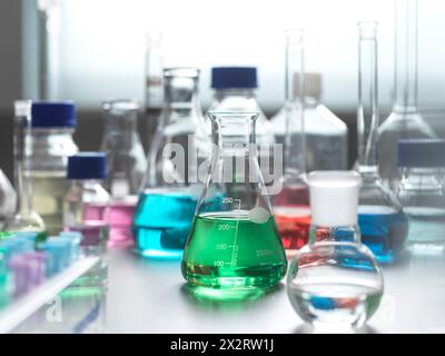 Laboratory glassware with multi colored chemical sample Stock Photo