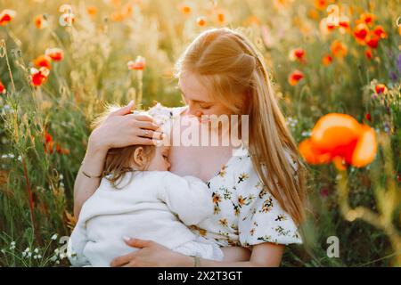 Mother breastfeeding her daughter Stock Photo - Alamy
