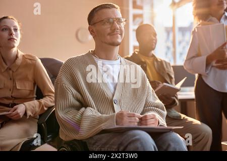 Smiling business people having meeting together in office Stock Photo