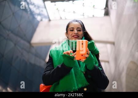 Happy woman using smart phone Stock Photo