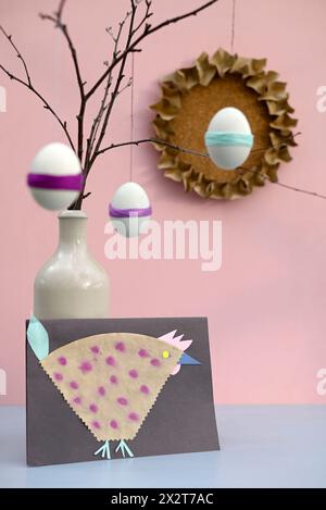 Studio shot of DIY Easter eggs and paper craft hen Stock Photo