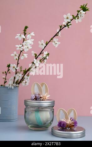Studio shot of blooming flowers and DIY Easter decorations Stock Photo