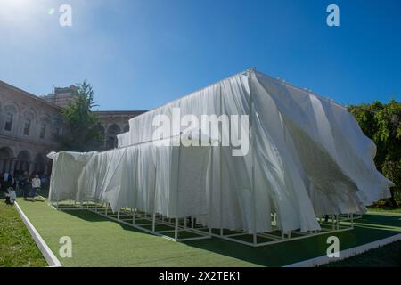 Milan Italy 20 April 2024: Sheets of paper flying lightly moved by the wind for the design Fuori Salone Stock Photo