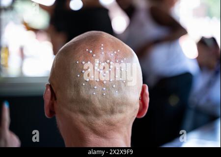 08.07.2023, Berlin, , Germany - Europe - A close-up of the back of a techno fan's head adorned with beads at the 2023 Rave the Planet parade, the succ Stock Photo
