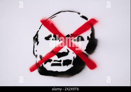 17.03.2024, Berlin, , Germany - Europe - A protest poster with the crossed-out portrait of Russian President Vladimir Putin during a demonstration in Stock Photo