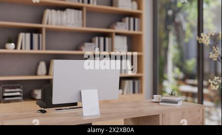 Back view image of a computer on a wooden desk in a beautiful contemporary private office or home office featuring a large bookshelf in the background Stock Photo