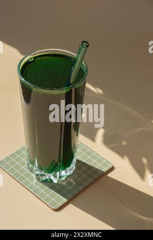 Organic blue-green algae spirulina detox drink in glass powder food. Health protein cocktail smoothie of chlorella. Vitamins and minerals to diet. Prebiotic and antioxidant rich Dietary supplement Seaweed superfood concept Stock Photo