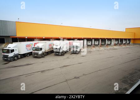 MOSCOW - OCT 16: Trucks loaded in stock in brewery Ochakovo on October 16, 2012 in Moscow, Russia. Ochakovo is largest Russian company beer and soft d Stock Photo