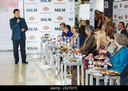 MOSCOW - OCT 22: Soviet and russian singer Iosif Kobzon performs before guests of holiday at salon World of Leather and Fur during celebration Phoney Stock Photo