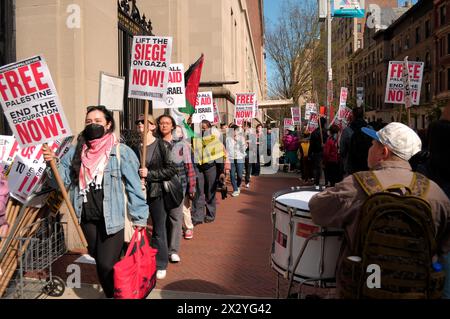 Pro-Palestine protesters hold placards expressing their opinions as they participate in a rally at Columbia University. Pro-Palestine demonstrators rallied at one of the entrances at Columbia University in Manhattan, New York City condemning the Israel Defense Forces' military operations in Gaza. Since last week, students and pro-Palestine activists inside the university have held a sit-in protest on the lawn, forming a 'Gaza Solidarity Encampment.' Students in other universities have been forming similar encampments in campuses nationwide in support of Palestine. Since the war started on Octo Stock Photo