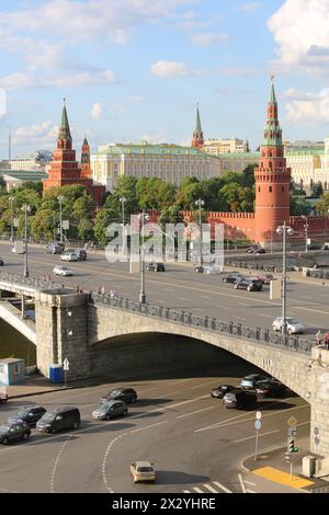 Big Stone Bridge, Grand Kremlin Palace, Towers of Kremlin at sunny day in Moscow, Russia. Rare view from House on embankment. Stock Photo