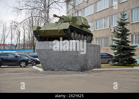 MOSCOW - APR 18: Armored artillery weapon SU-76 on pedestal near to building of plant management of Mytishchi Machine-building factory, April 18, 2012 Stock Photo