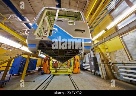 MYTISHCHI - APR 18: To-be assembled wagon on jacks in shop floor at Mytishchi Metrovagonmash factory, April 18, 2012, Mytishchi, Russia. The plant is Stock Photo