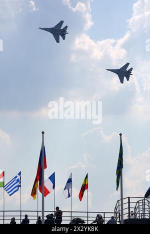 ZHUKOVSKY - AUGUST 12: Two Russian SU-27 aircrafts at airshow on 100th anniversary of Russian Air Force on August 12, 2012 in Zhukovsky, Moscow region Stock Photo