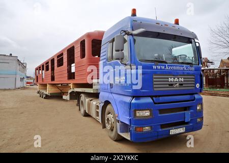 MYTISHCHI - APR 18: Truck, loaded with coach at Mytishchi Machine-building factory, April 18, 2012, Mytishchi, Russia. The plant was founded in 1897 t Stock Photo