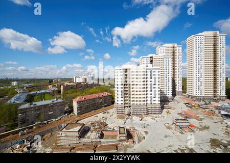 MOSCOW - APR 30: Buildings under construction of residential compound Elk Island, April 30, 2012, Moscow, Russia. This is 12-29 storey buildings with Stock Photo