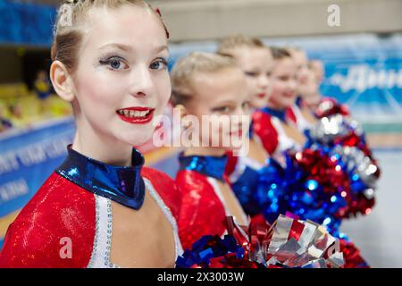 MOSCOW - MAR 24:  Portrait of participant of cheerleaders girl team at Championship and Contests of Moscow in cheerleading at Palace of Sports Dynamo, Stock Photo