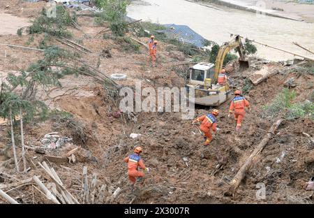 Beijing, China's Guangdong Province. 22nd Apr, 2024. Firefighters work at Jiangwan Town of Shaoguan City, south China's Guangdong Province, April 22, 2024. Four people were killed and 10 others remain missing after continuous heavy rainfall hit many parts of south China's Guangdong Province in recent days, local authorities said Monday.Guangdong has so far relocated some 110,000 residents, with 25,800 people being urgently resettled. Credit: Lu Hanxin/Xinhua/Alamy Live News Stock Photo