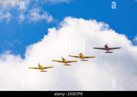 Propeller planes flying in formation in the sky Stock Photo