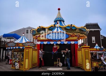 Artist Performance at the Carousel of Pier 39 - Fisherman's Wharf, San Francisco, California Stock Photo