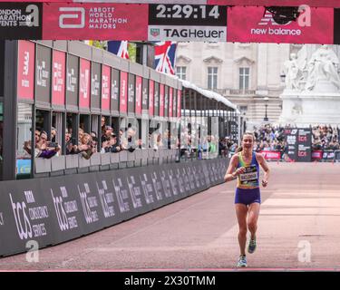 Mhairi MacLennan, first British Elite runner through,  crosses the finish line in the 2024 London Marathon, UK Stock Photo