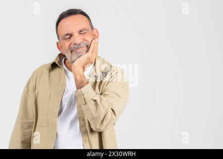 Man With Hand on Face, Suffer From Toothache Stock Photo