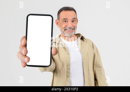 Man Holding Smart Phone in Hand, Copy Space Stock Photo