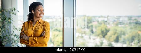 Portrait of confident african american businesswoman standing near window Stock Photo