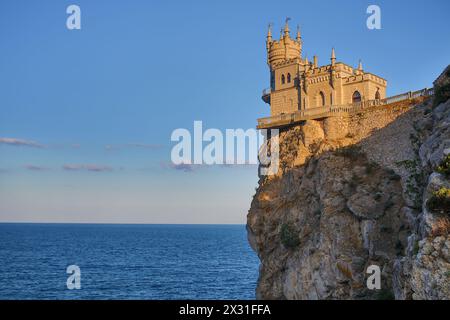 Castle Swallows Nest on the cliff near the sea with skyline Stock Photo